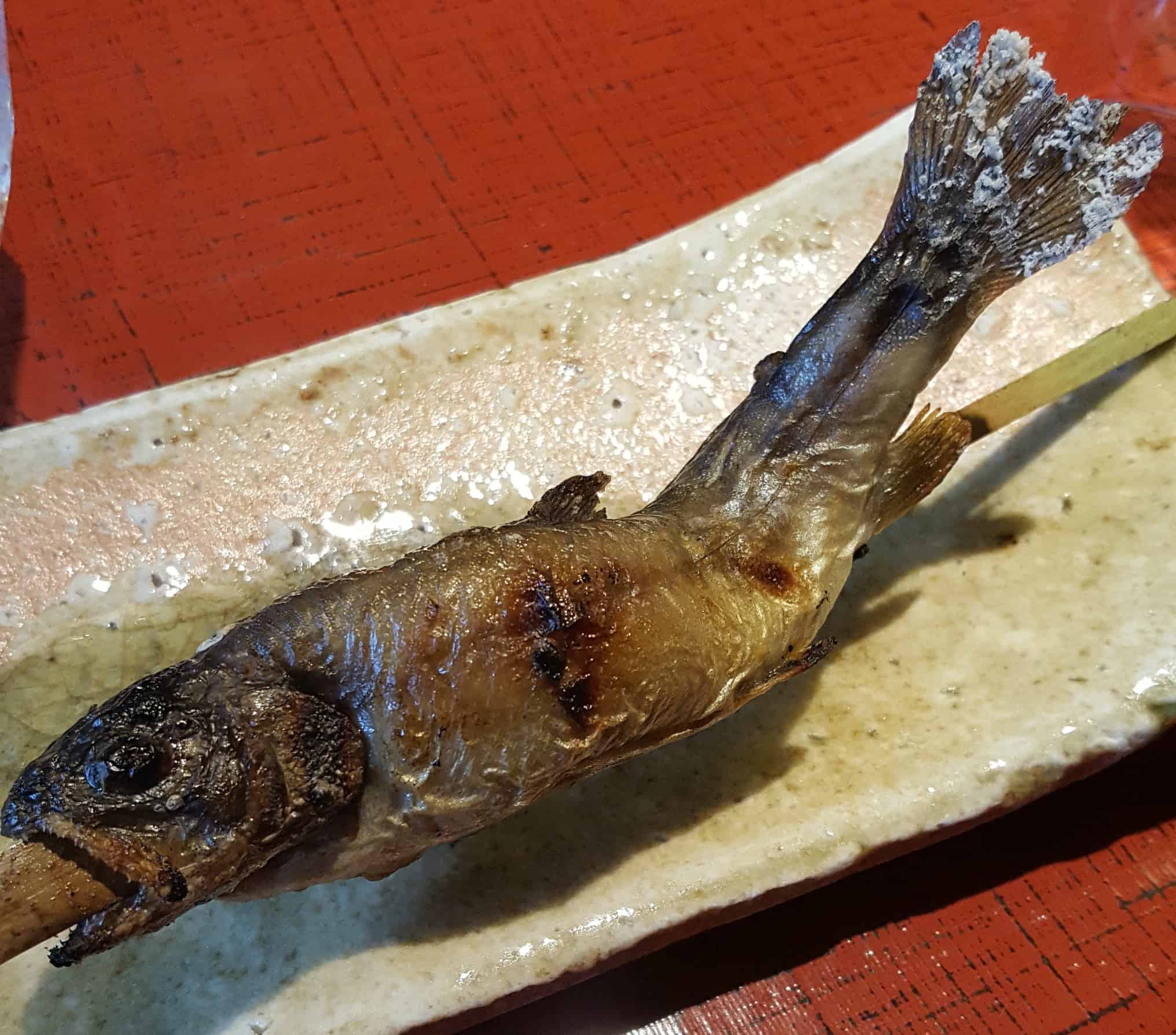 fried fish on a skewer