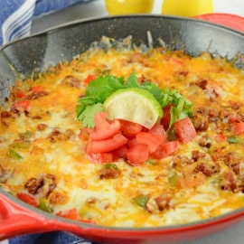 Queso Fundido with Chorizo is the best Mexican Cheese Dip made with a blend of Mexican cheeses, smoky, spicy Chorizo and fresh vegetables. #quesofundido #cheesedip www.savoryexperiments.com