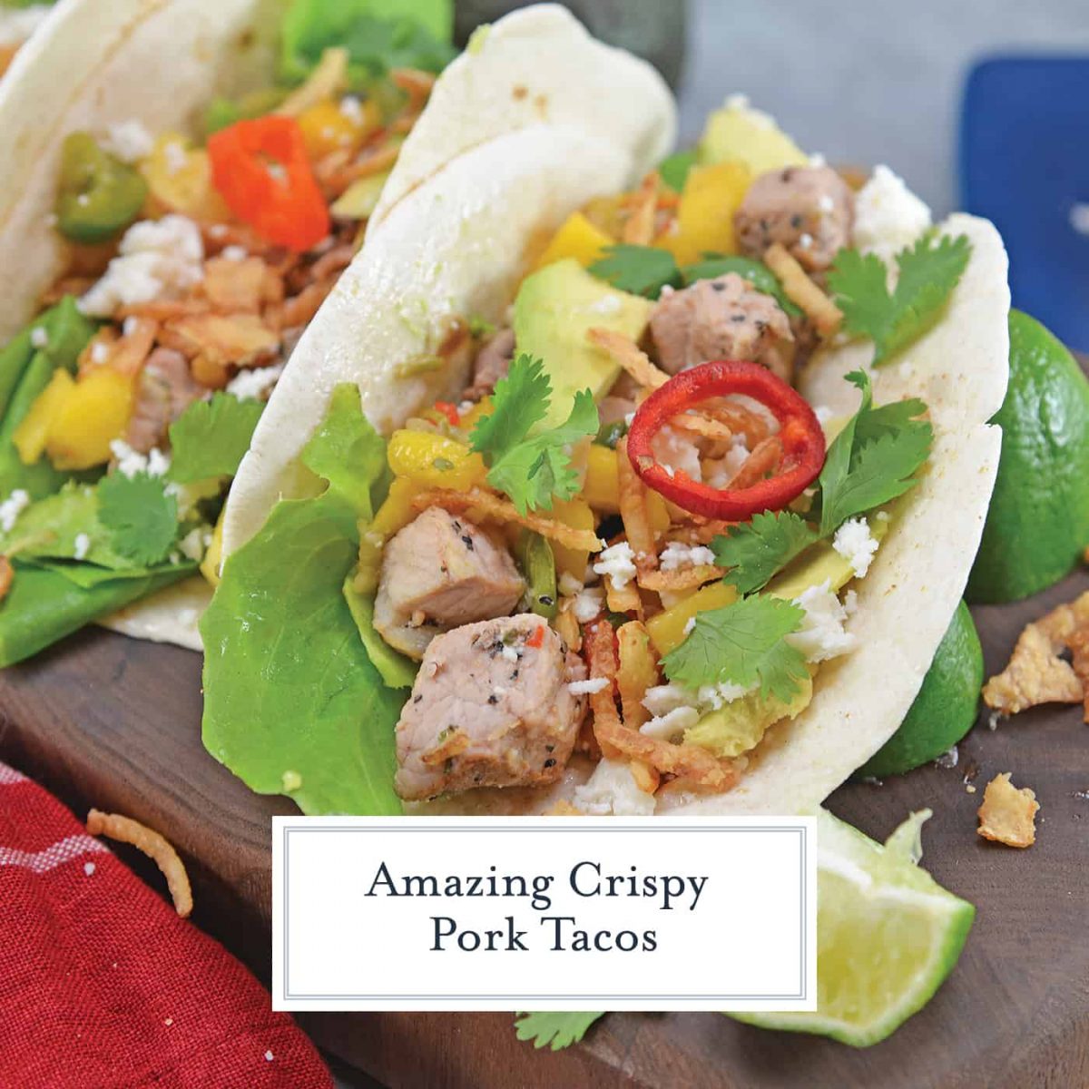 Crispy Pork Tacos are soft tacos filled with mango salsa, cool avocado, crumbly queso fresco, butter lettuce and crispy onion straws. #porktacos #streettacos #homemadetacos www.savoryexperiments.com