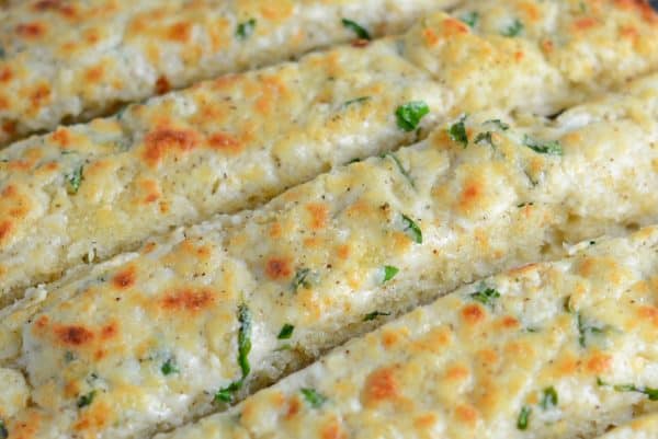 Cheesy Garlic Bread 2 Cheesy Garlic Bread is made with a blend of cheese, cream cheese, garlic and seasonings to make the BEST garlic bread you've ever tasted!