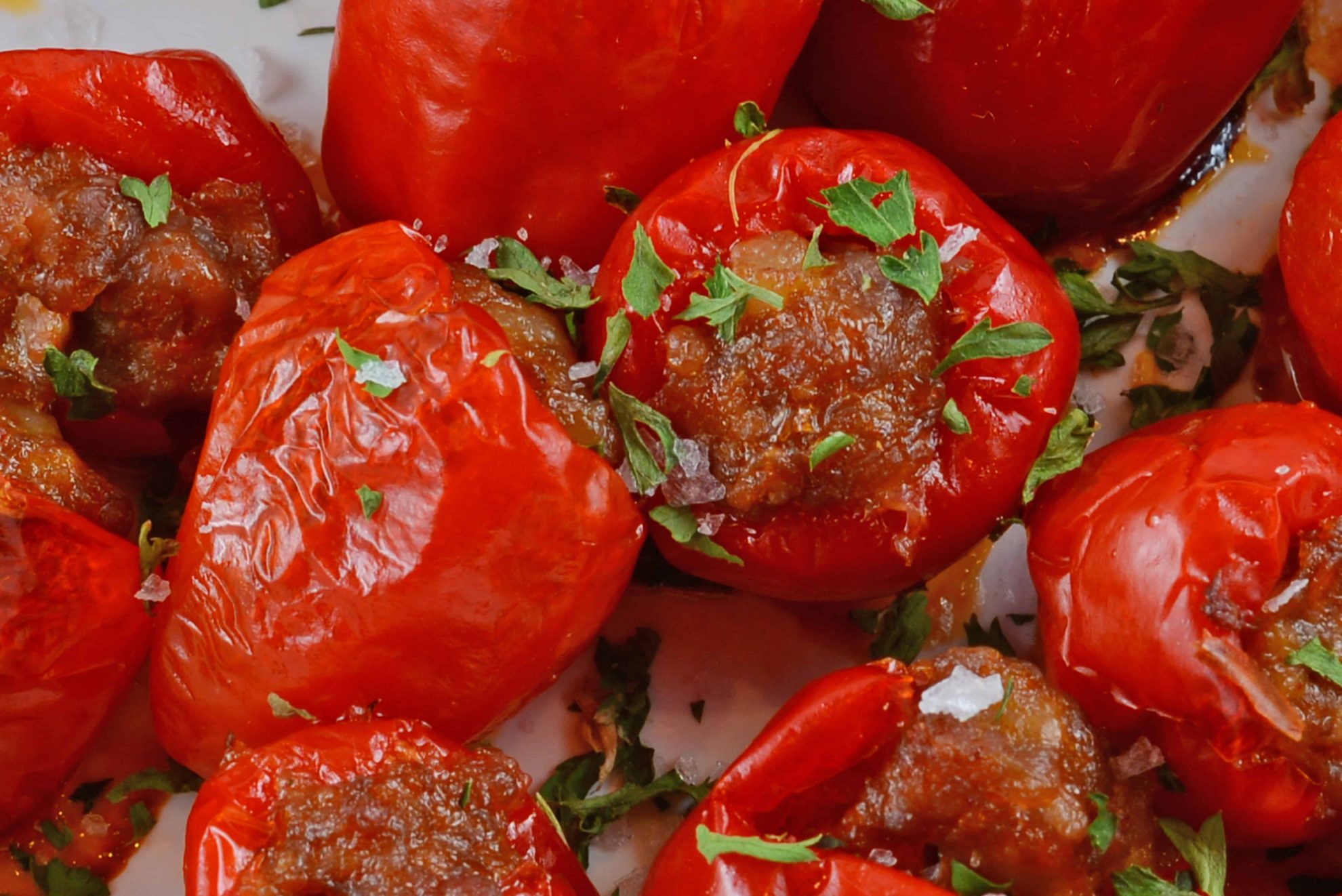 Sausage Stuffed Cherry Peppers are a tasty and easy appetizer recipe using only 5 ingredients. The perfect party food for any occasion! #stuffedpeppers #easyappetizers www.savoryexperiments.com 