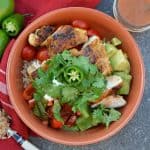 Chipotle Chicken Rice Bowls are a zesty chipotle chicken with fresh produce and sweet dressing. Ready in just 30 minutes and perfect as a meal prep recipe!