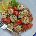 Garlic Butter Shrimp is a quick and easy meal solution that takes only 10 minutes to prepare! Served over wholesome quinoa with garlicky shrimp and tomatoes.
