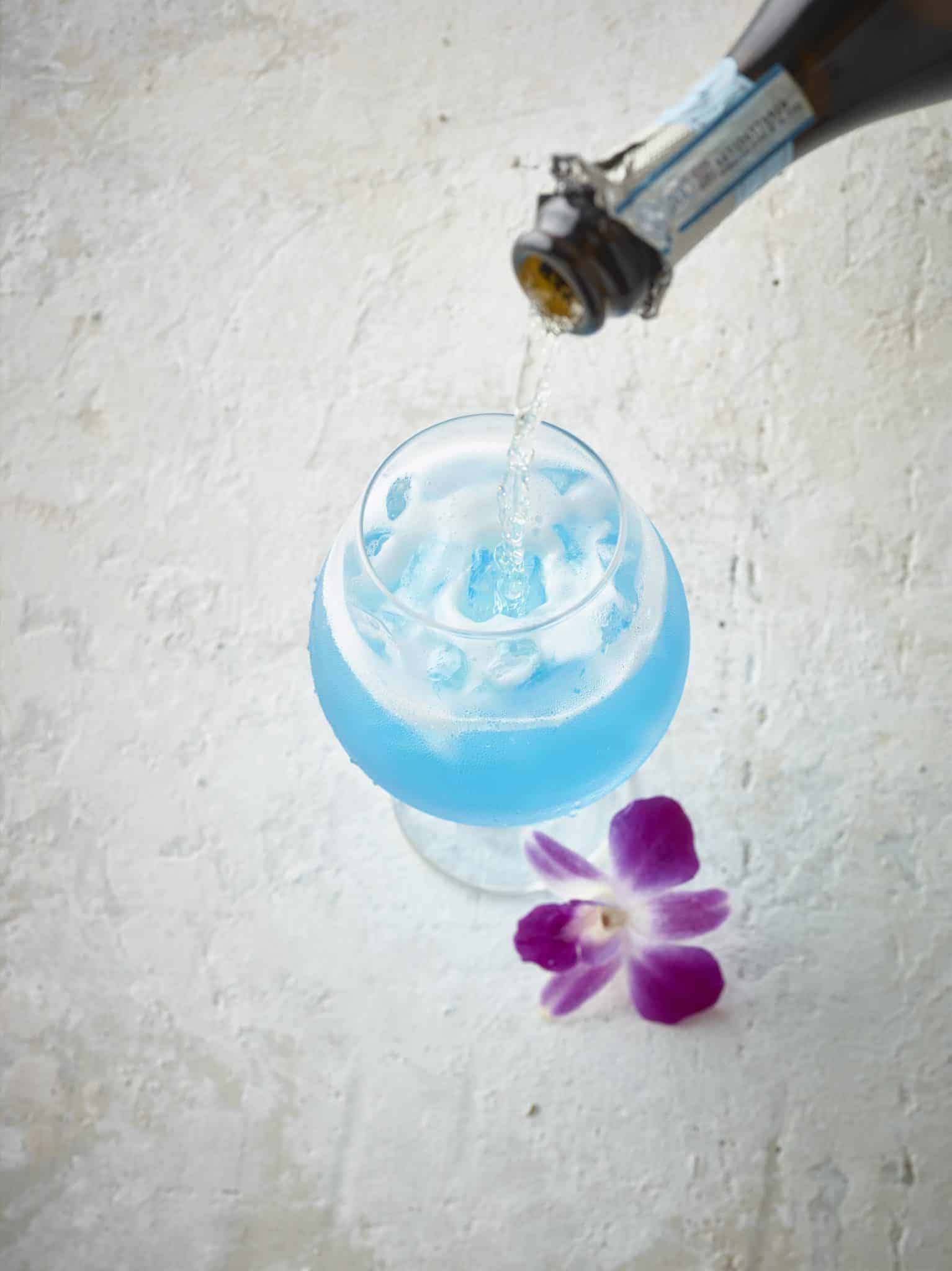 Sparkling Blue Hawaiian Cocktail is a refreshing tropical cocktail recipe perfect for luau theme parties or a lazy Sunday afternoon.