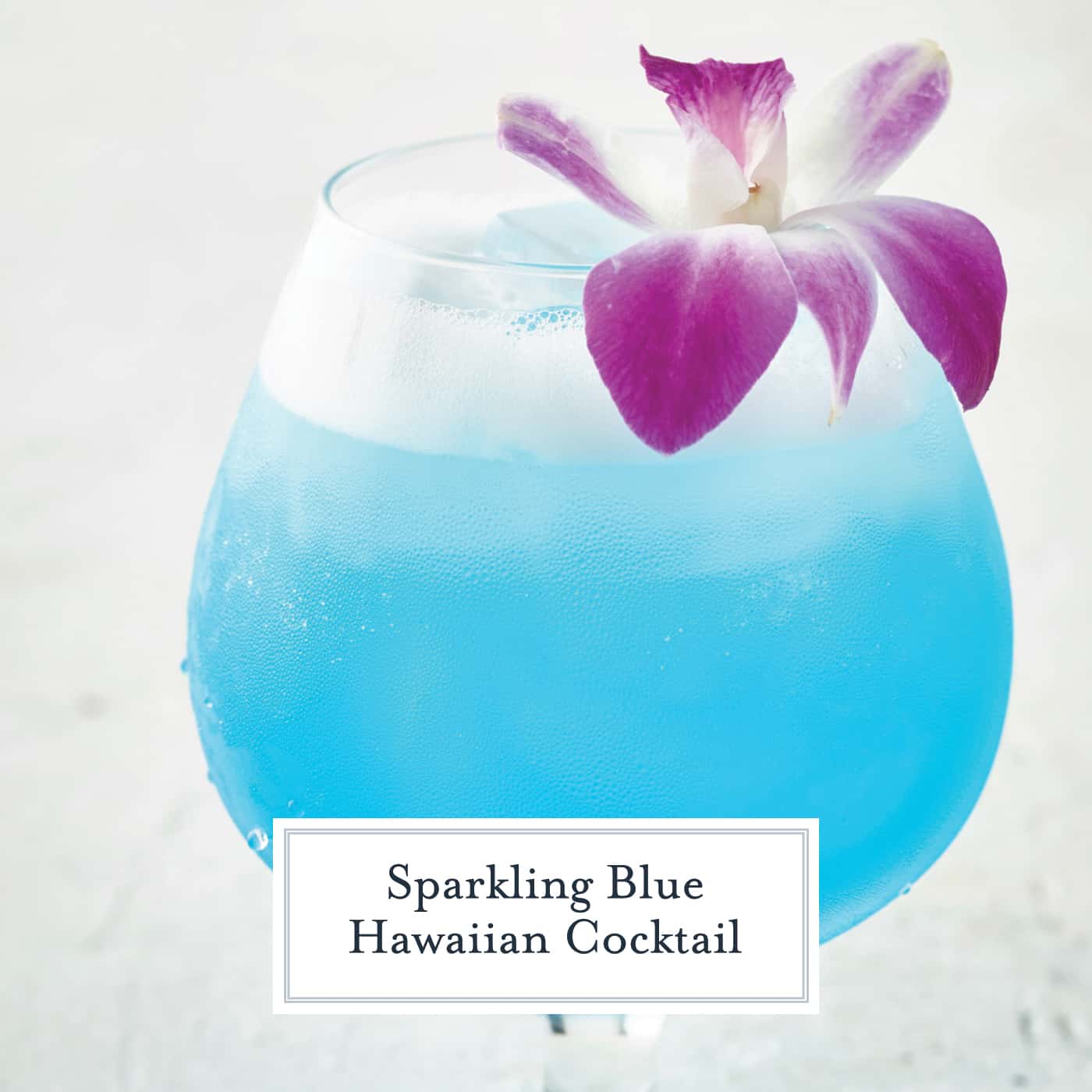 Sparkling Blue Hawaiian Cocktail is a refreshing tropical cocktail recipe perfect for luau theme parties or a lazy Sunday afternoon. #bluehawaiian #cocktailrecipes #tropicaldrinks www.savoryexperiments.com 