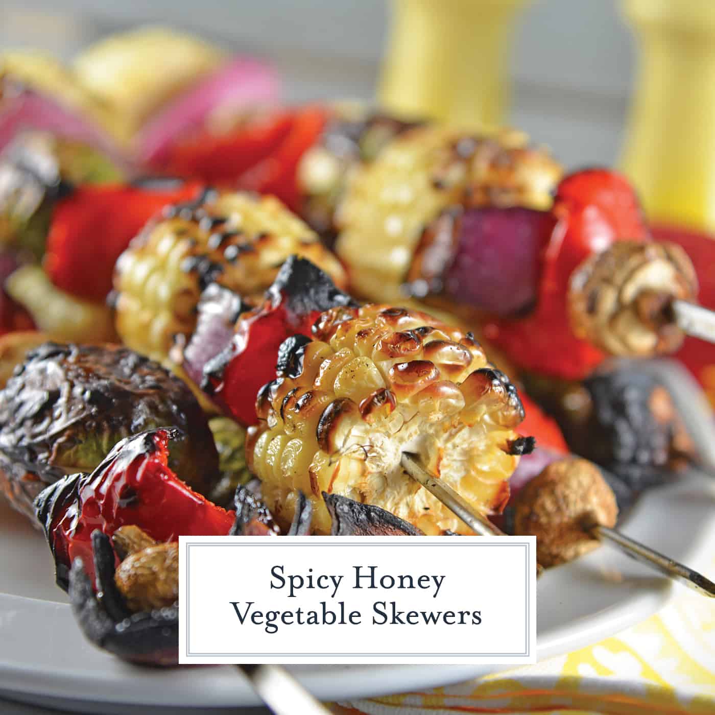 Spicy Honey Vegetable Kabobs are brightly colored skewered grilled vegetables with a sweet and spicy sauce. The perfect side dish for any grilled meal! #vegetablekabobs #grilledvegetables www.savoryexperiments.com