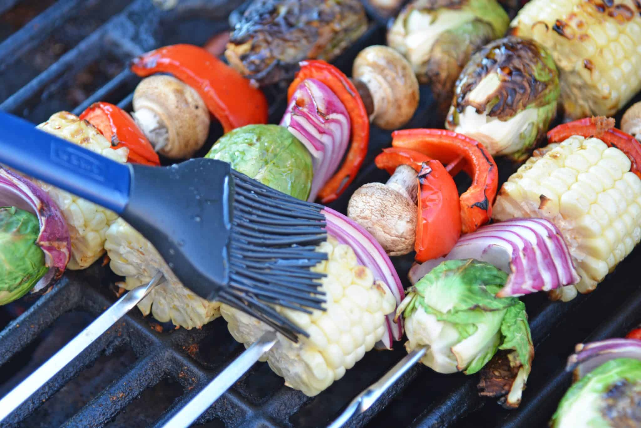 Spicy Honey Vegetable Kabobs are brightly colored skewered grilled vegetables with a sweet and spicy sauce. The perfect side dish for any grilled meal!