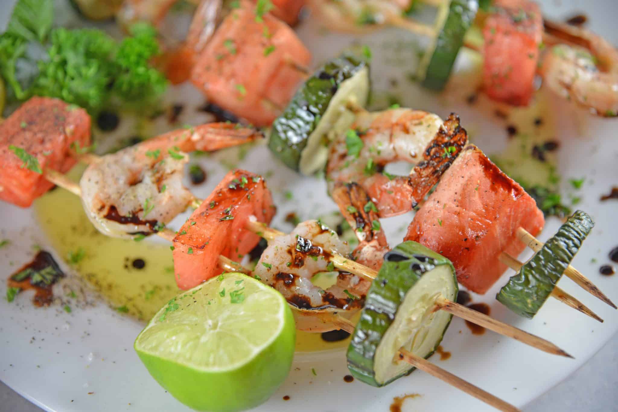 Watermelon Shrimp Kabobs combine grilled shrimp with grilled watermelon with a sweet balsamic reduction and zesty lime. A healthy kabob recipe on the grill.
