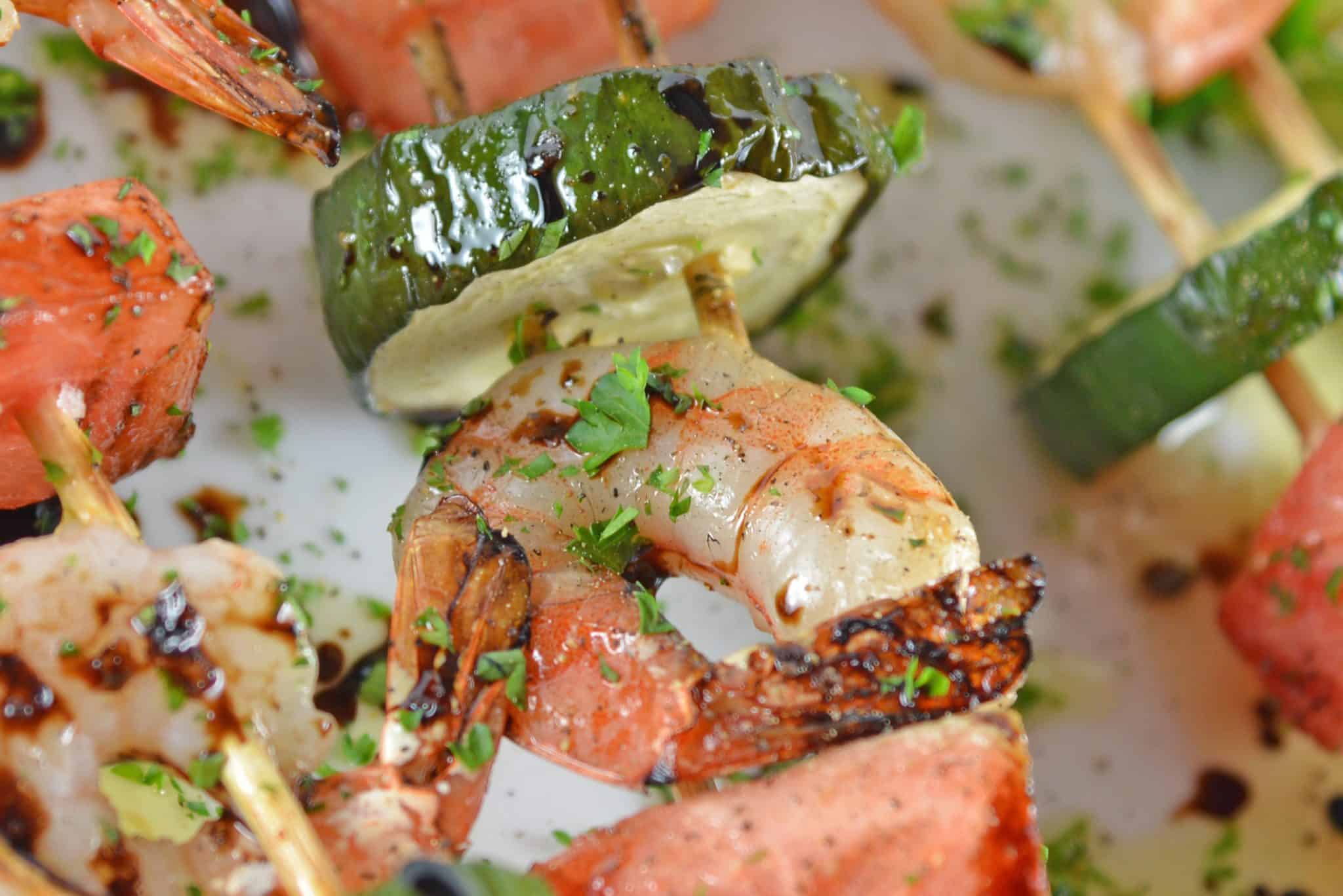 Watermelon Shrimp Kabobs combine grilled shrimp with grilled watermelon with a sweet balsamic reduction and zesty lime. A healthy kabob recipe on the grill.