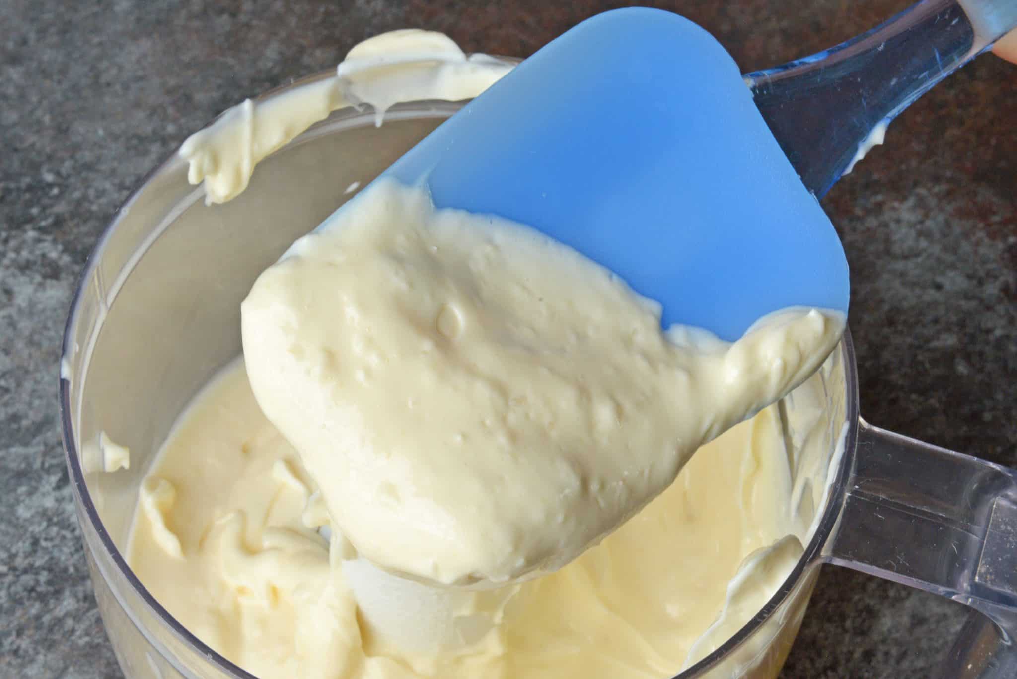 spatula in garlic aioli in a food processor