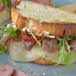 Insane Steak Sandwiches are gourmet sandwiches, seasoned to perfection with zesty Italian herbs and toppings. The best steak sandwich recipe ever! #steaksandwiches #gourmetsandwiches www.savoryexperiments.com