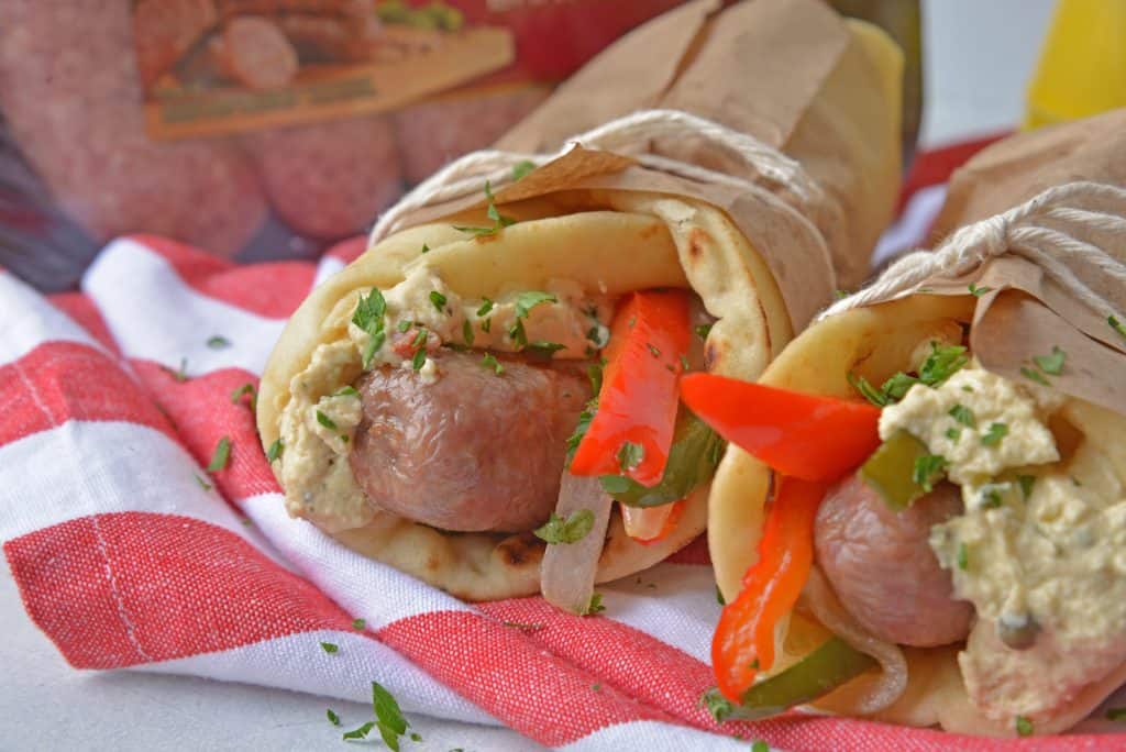 Mediterranean Yuengling Bratwurst use bratwurst injected with Yuengling, bell peppers and onion, garlic hummus and wrapped in naan. www.savoryexperiments.com