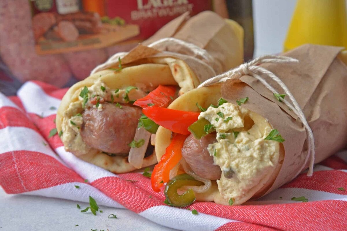 Mediterranean Yuengling Bratwurst use bratwurst injected with Yuengling, bell peppers and onion, garlic hummus and wrap them in naan. www.savoryexperiments.com