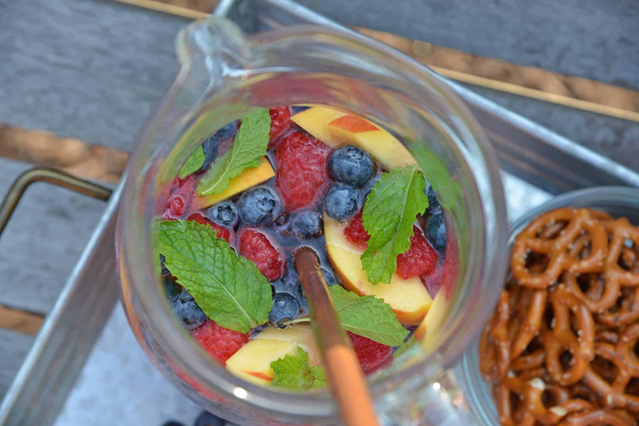 Sparkling Peach Sangria is the perfect summer cocktail recipe for your next party! Make a non-alcoholic and alcoholic version with fresh summer fruits.