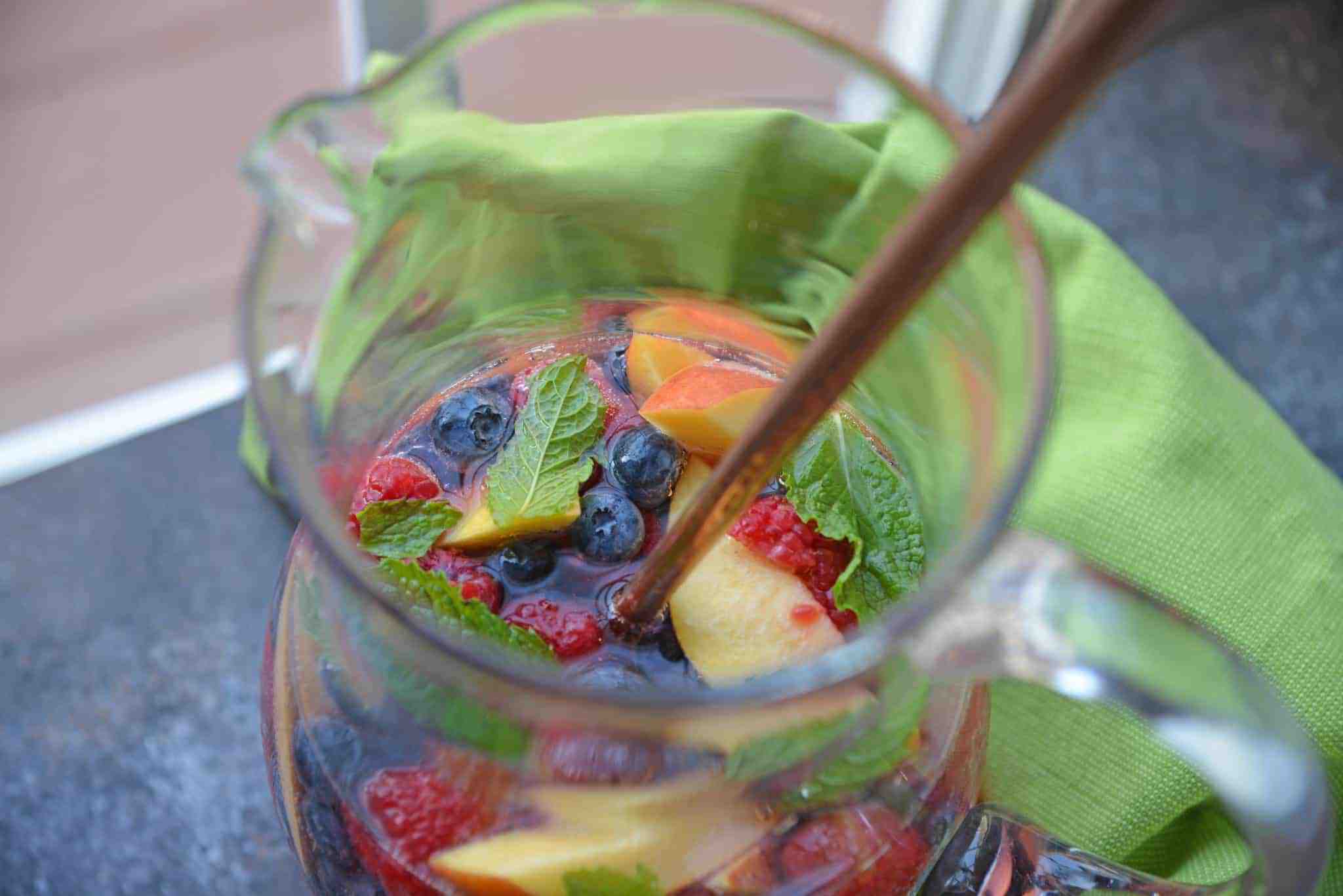 Sparkling Peach Sangria is the perfect summer cocktail recipe for your next party! Make a non-alcoholic and alcoholic version with fresh summer fruits.