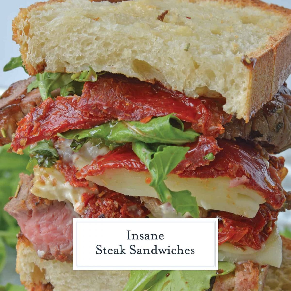 Insane Steak Sandwiches are gourmet sandwiches, seasoned to perfection with zesty Italian herbs and toppings. The best steak sandwich recipe ever! #steaksandwiches #gourmetsandwiches www.savoryexperiments.com