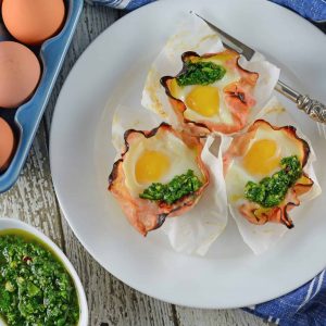 Chimichurri Egg Muffins are eggs baked in ham with a zesty chimichurri sauce made with fresh herbs and garlic. The perfect make ahead breakfast idea! #greeneggsandham #eggmuffins www.savoryexperiments.com