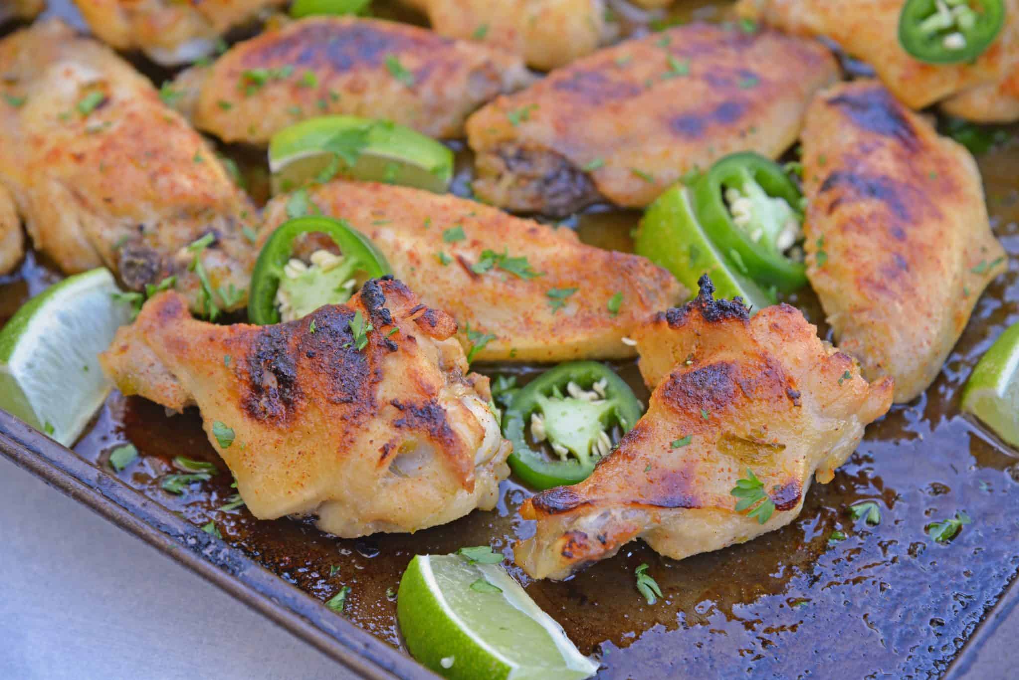 Sweet and spicy Jalapeno Lime Wings are baked wings perfect for holiday parties or watching the big game. A unique flavor everyone will love. #bakedchickenwings #chickenwingrecipes www.savoryexperiments.com
