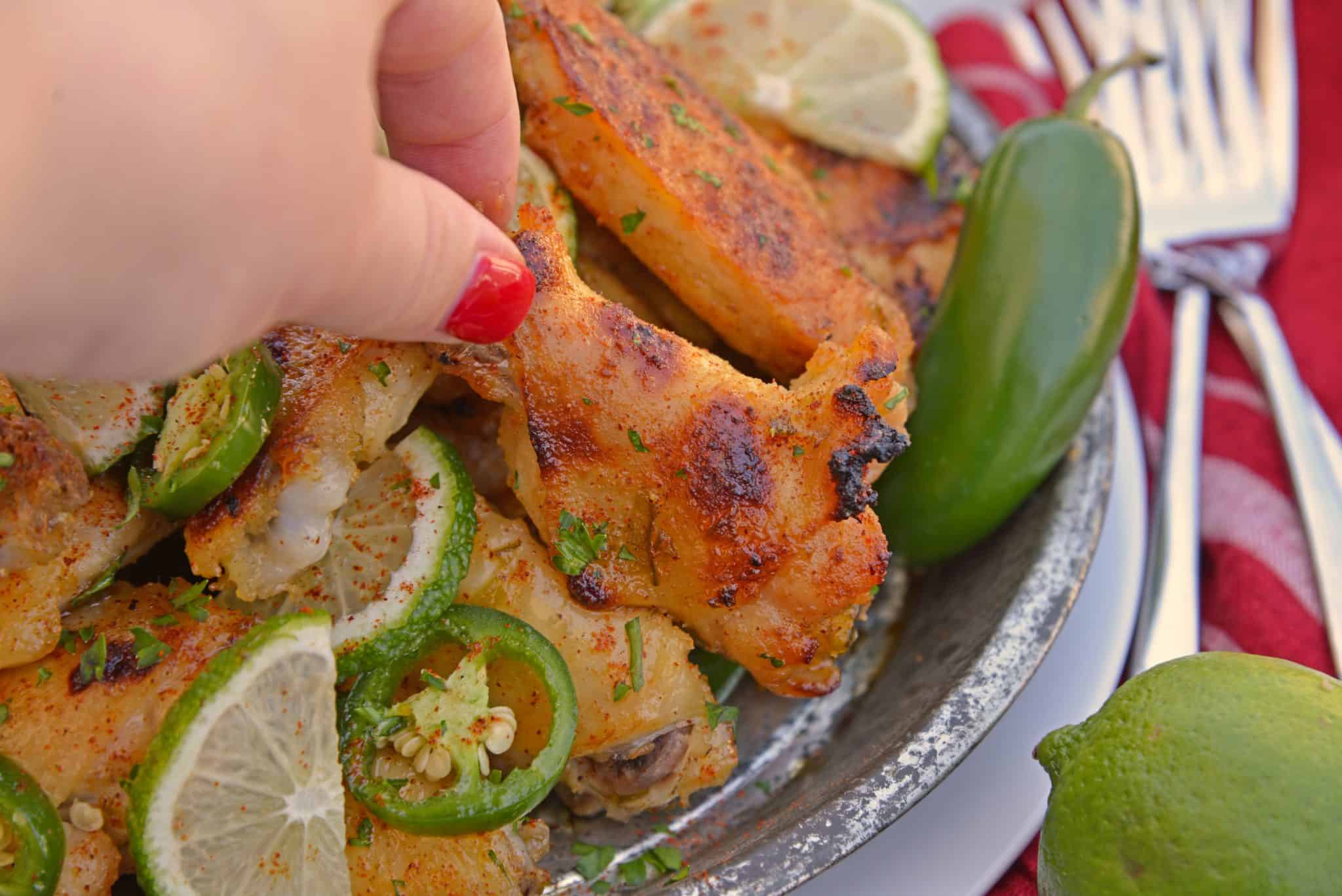 Sweet and spicy Jalapeno Lime Wings are baked wings perfect for holiday parties or watching the big game. A unique flavor everyone will love. #bakedchickenwings #chickenwingrecipes www.savoryexperiments.com