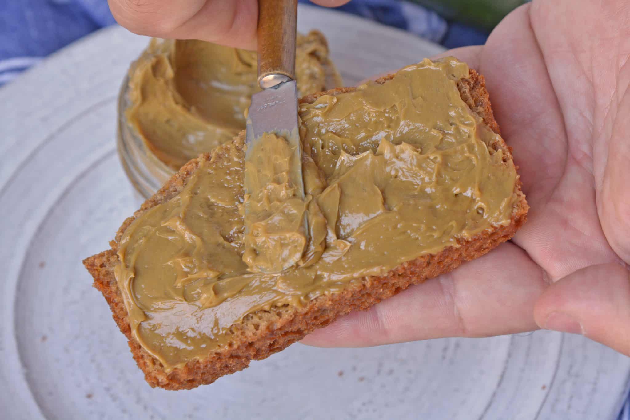 Molasses Butter is the blend of butter, molasses and one secret ingredient that will never guess until see the recipe! Served best on fresh zucchini bread and biscuits! #flavoredbutter #molassesbutter www.savoryexperiments.com