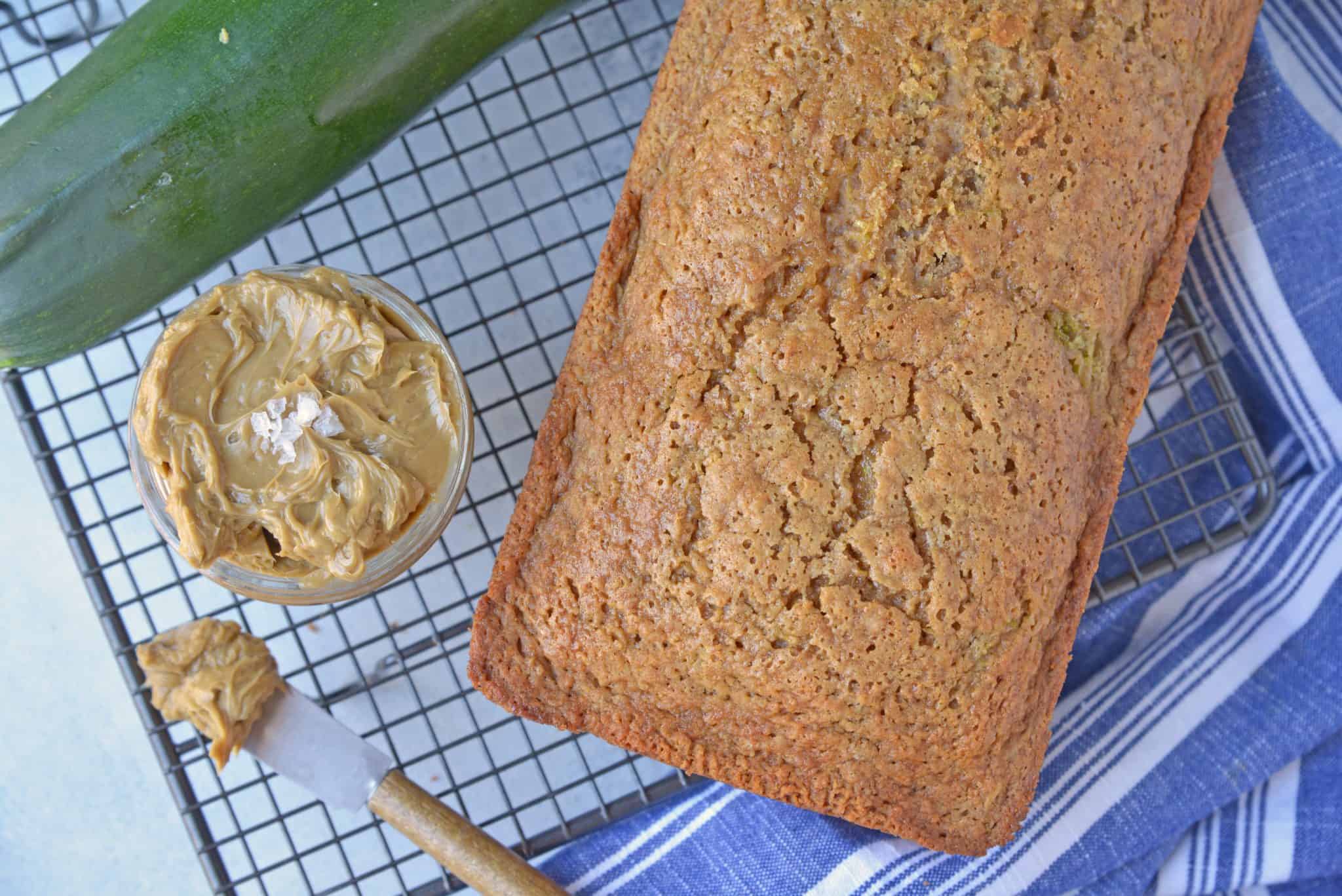 Molasses Butter is the blend of butter, molasses and one secret ingredient that will never guess until see the recipe! Served best on fresh zucchini bread and biscuits! #flavoredbutter #molassesbutter www.savoryexperiments.com 