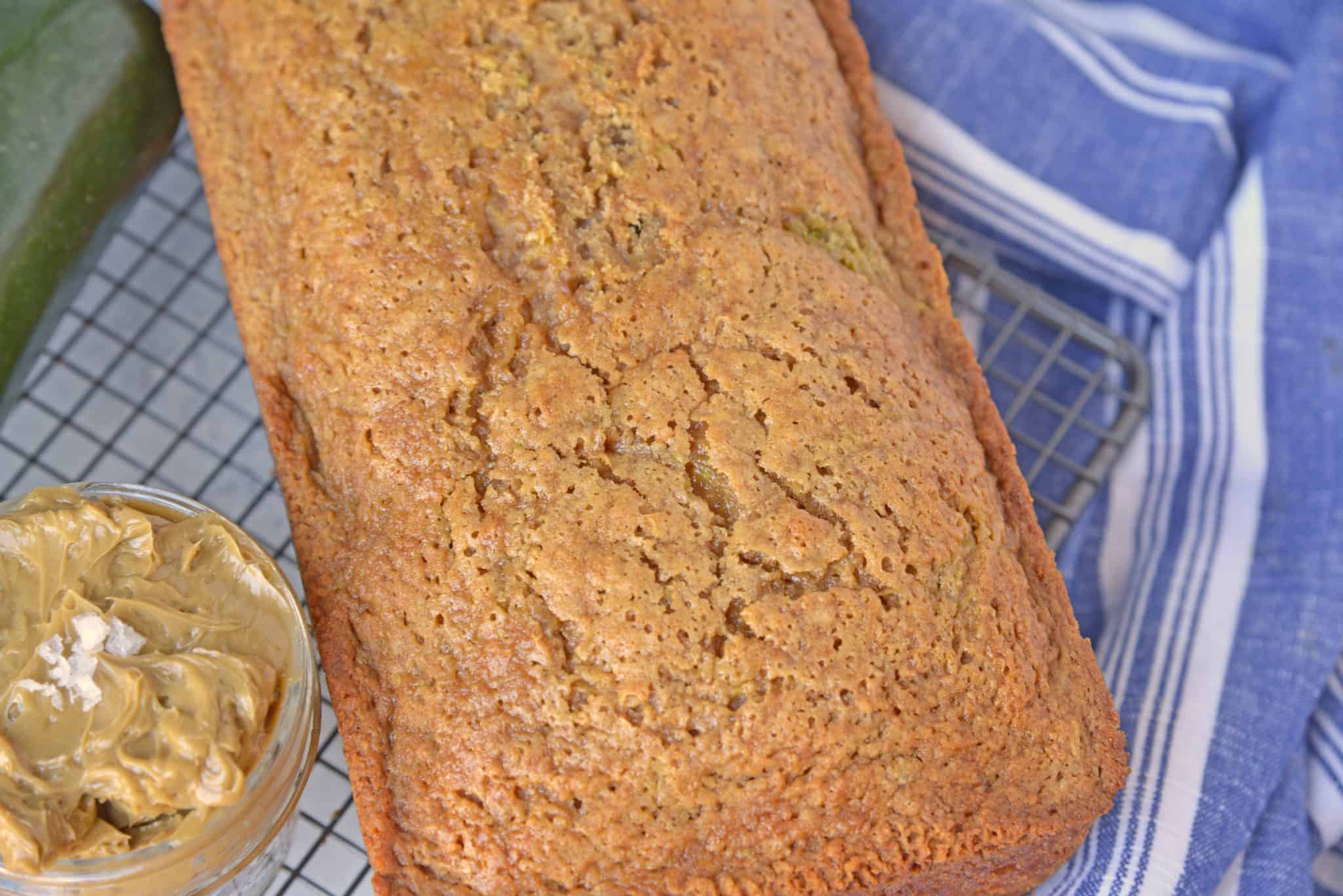 Best Zucchini Bread is the most moist zucchini bread recipe made by a pastry chef. One of the best zucchini recipes ever! Serve with zingy molasses butter. #bestzucchinibread #zucchinirecipes www.savoryexperiments.com 