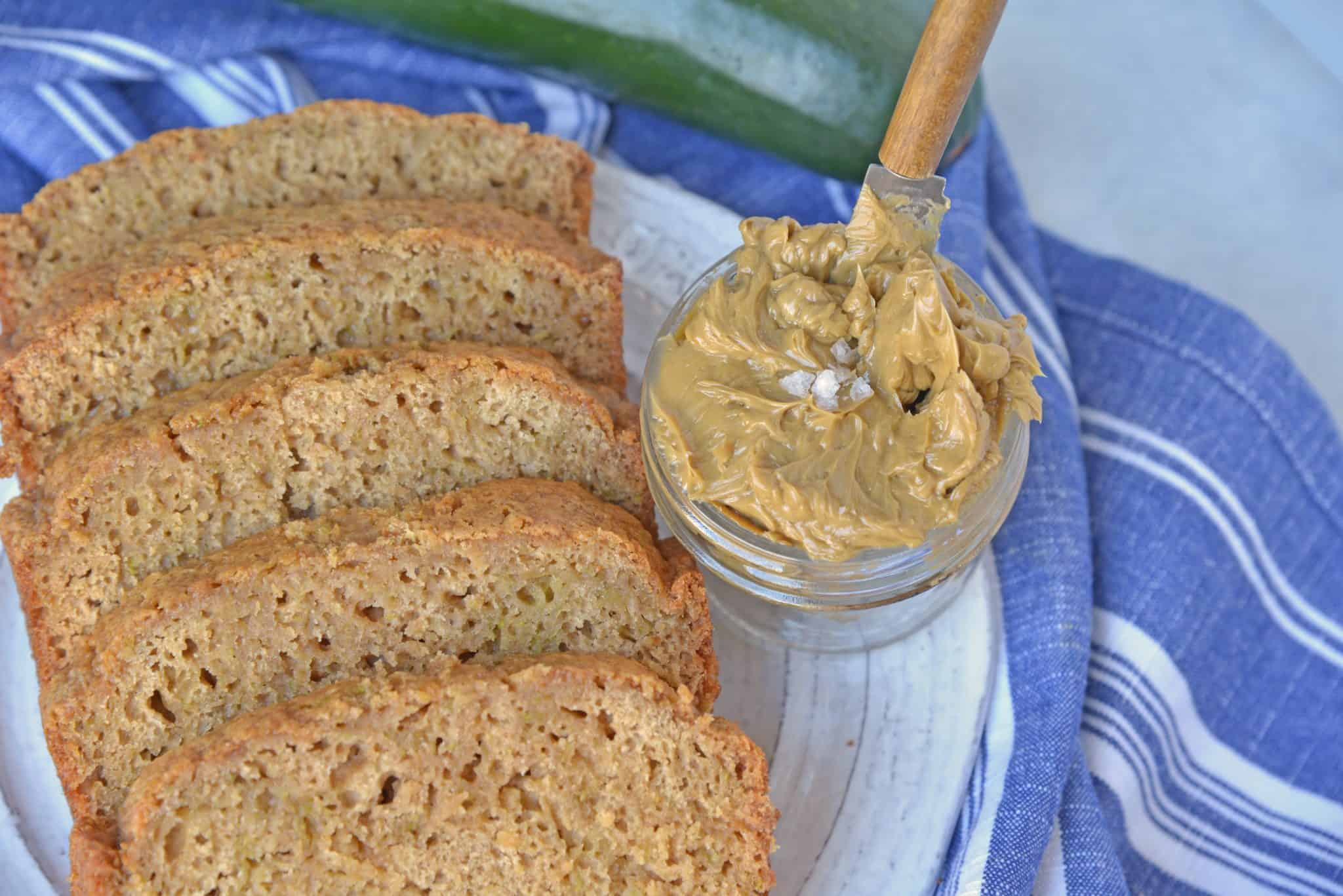 Best Zucchini Bread is the most moist zucchini bread recipe made by a pastry chef. One of the best zucchini recipes ever! Serve with zingy molasses butter. #bestzucchinibread #zucchinirecipes www.savoryexperiments.com 