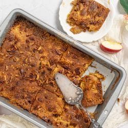 overhead shot of sliced apple dump cake in pan