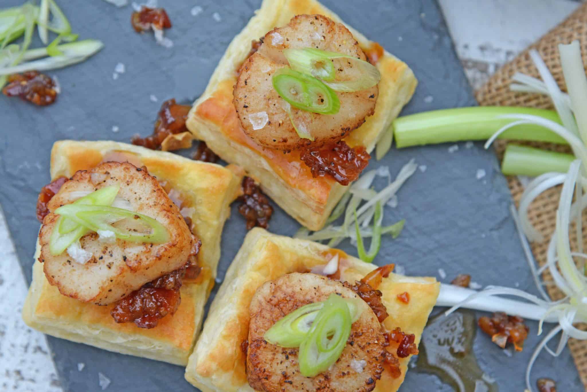 Bacon Jam Scallops are a play on classic bacon wrapped scallops, only using sweet and salty bacon jam with scallions and flaky puff pastry! #scallopappetizers #baconjam www.savoryexperiments.com