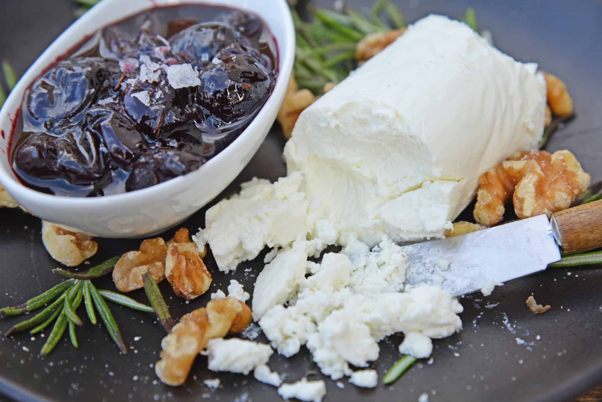 Balsamic Cherry Crostini is an easy appetizer using goat cheese and a tangy cherry balsamic reduction. The perfect holiday appetizer recipe! #crostinirecipes #easyappetizerrecipes www.savoryexperiments.com