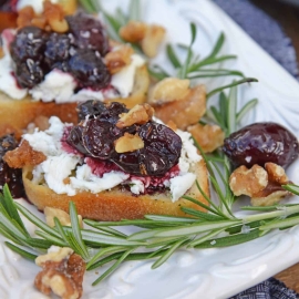 Balsamic Cherry Crostini are an easy appetizer using goat cheese and a tangy cherry balsamic reduction. The perfect holiday appetizer recipe! #crostinirecipes #goatcheeserecipes #easyappetizerrecipes www.savoryexperiments.com
