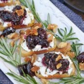 Balsamic Cherry Crostini is an easy appetizer using goat cheese and a tangy cherry balsamic reduction. The perfect holiday appetizer recipe! #crostinirecipes #easyappetizerrecipes www.savoryexperiments.com