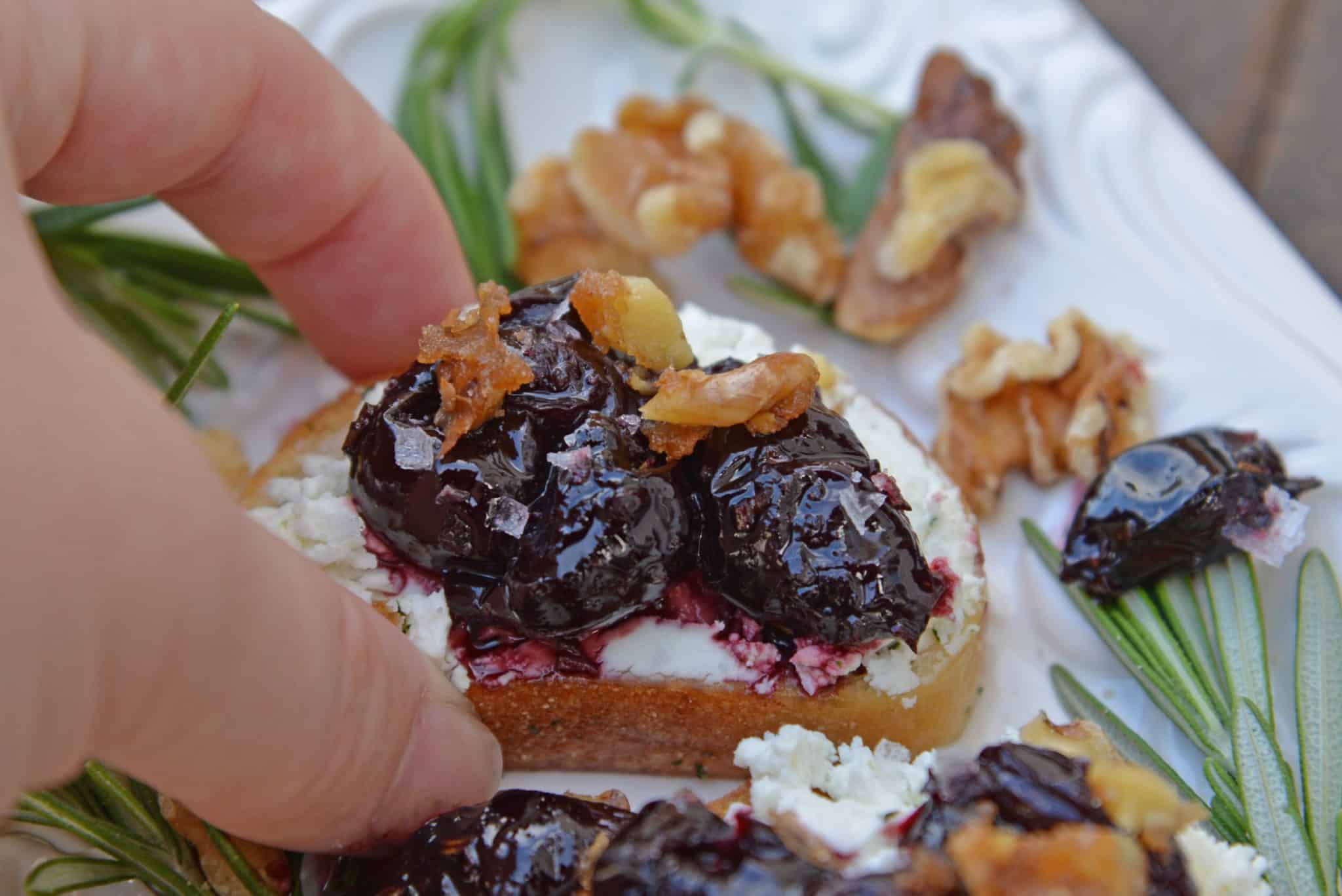 Balsamic Cherry Crostini is an easy appetizer using goat cheese and a tangy cherry balsamic reduction. The perfect holiday appetizer recipe! #crostinirecipes #easyappetizerrecipes www.savoryexperiments.com