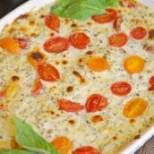 Hot Caprese Dip is a party appetizer favorite using mozzarella, pesto and sweet tomatoes. An easy appetizer your guests will love! #capresedip #capresesalad #partyappetizers www.savoryexperiments.com