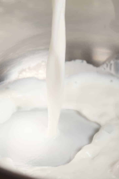 Milk being poured into a pan
