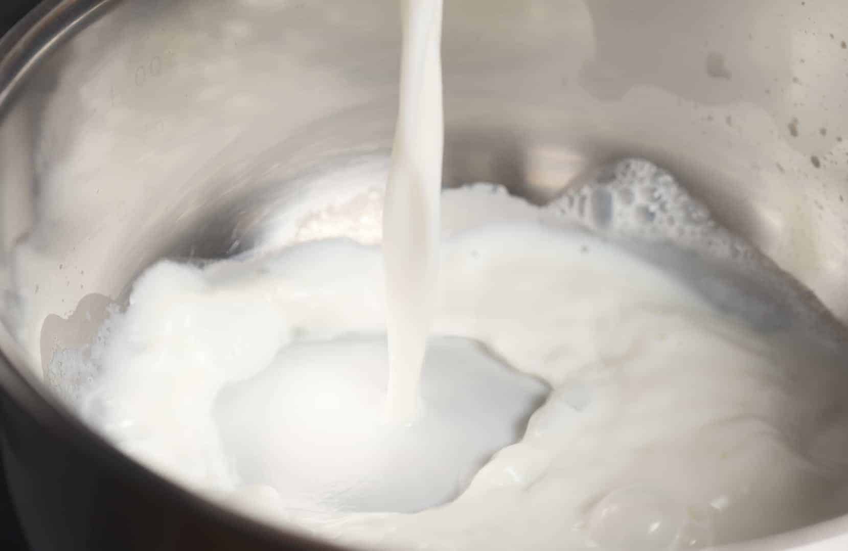 Scalded milk is milk heated to a near boil, then cooled. It makes cakes, breads and anything with yeast fluffier and and lighter. #howtoscaldmilk #scaldedmilk www.savoryexperiments.com