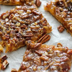 pecan pie bars on parchment paper