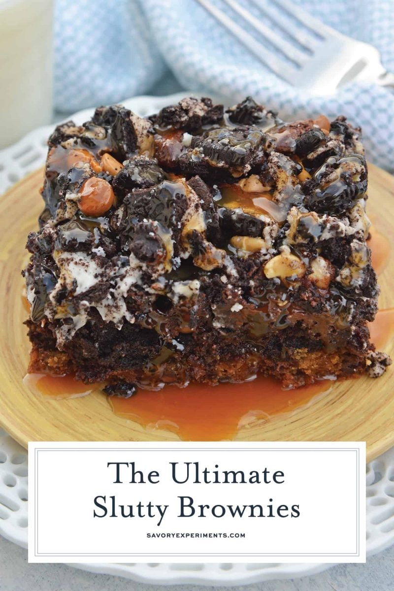 caramel covered slutty brownies on a wood plate