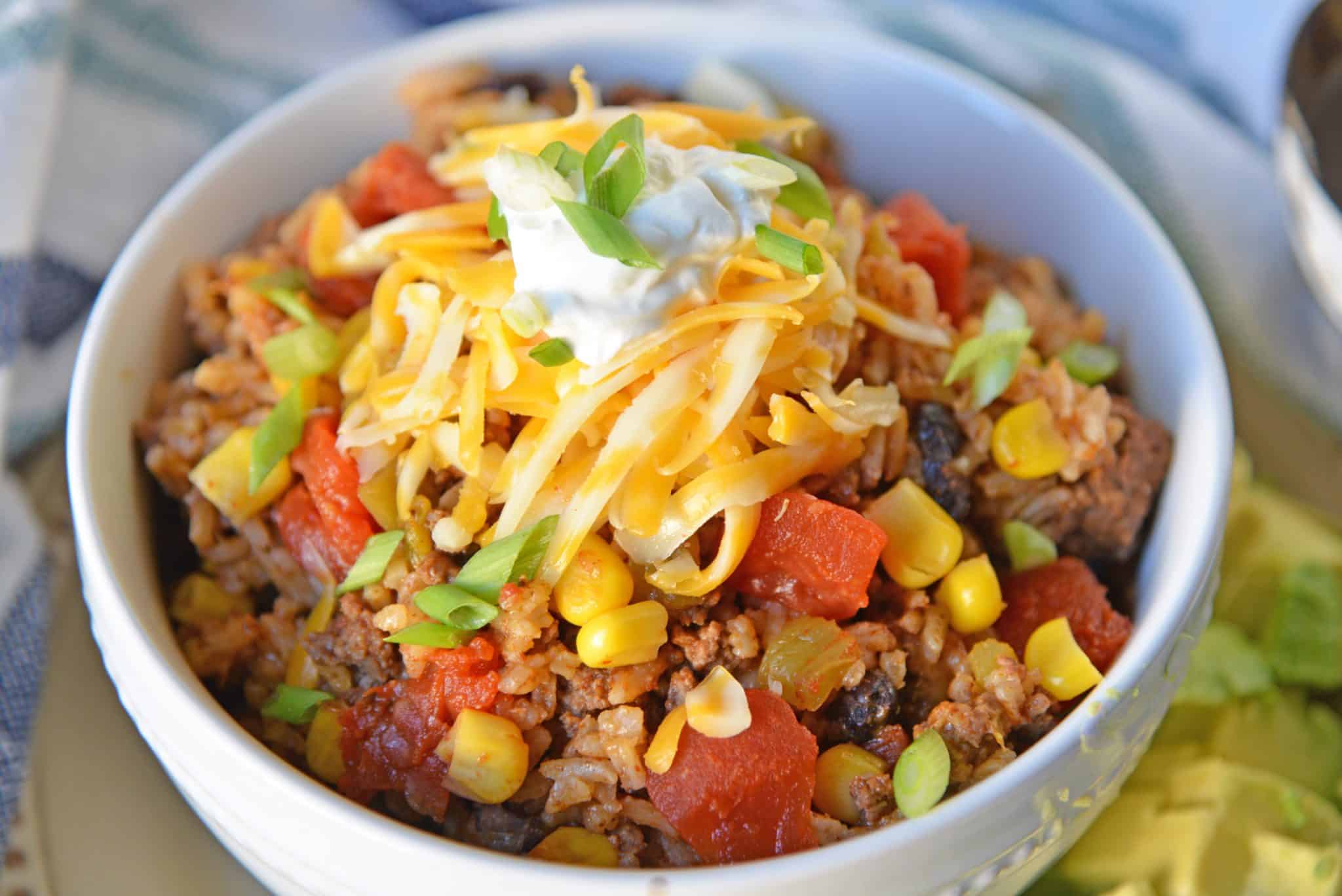 Mexican Beef and Rice Casserole is an easy weeknight recipe using ground beef, taco seasoning and other easy ingredients for a one dish meal! #onedishrecipes #groundbeefrcipes www.savoryexperiments.com