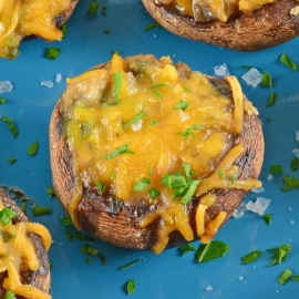 Creamy Jalapeno Stuffed Mushrooms are an easy jalapeno popper make ahead recipe using cream cheese and fresh jalapenos. The perfect party appetizer! #stuffedmushrooms #jalapenopopperrecipes #makeaheadappetizers www.savoryexperiments.com