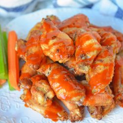 Crispy Baked Buffalo Wings are easier to make than you think. Only 5 ingredients, a simple buffalo sauce and the trick for seriously crispy wings! #bakedbuffalowings www.savoryexperiments.com