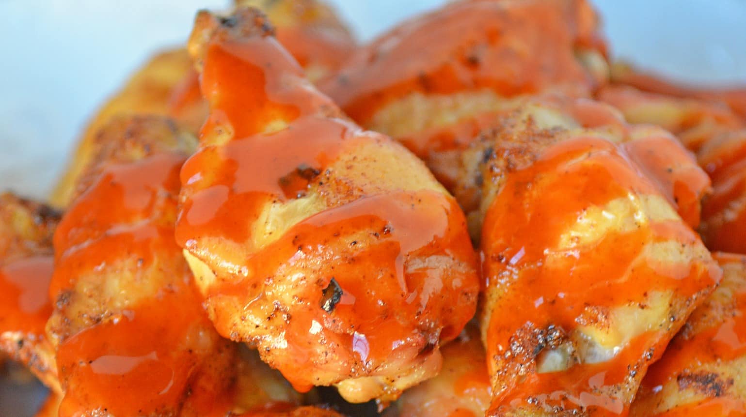 Crispy Baked Buffalo Wings are easier to make than you think. Only 5 ingredients, a simple buffalo sauce and the trick for seriously crispy wings! #bakedbuffalowings www.savoryexperiments.com 