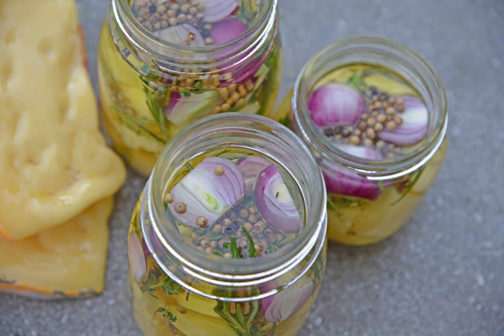 Marinated Cheese is the perfect hostess or homemade holiday gift. Simple and tasty, it also makes an easy party appetizer! #marinatedcheese #easypartyappetizers #homemadegifts www.savoryexperiments.com 