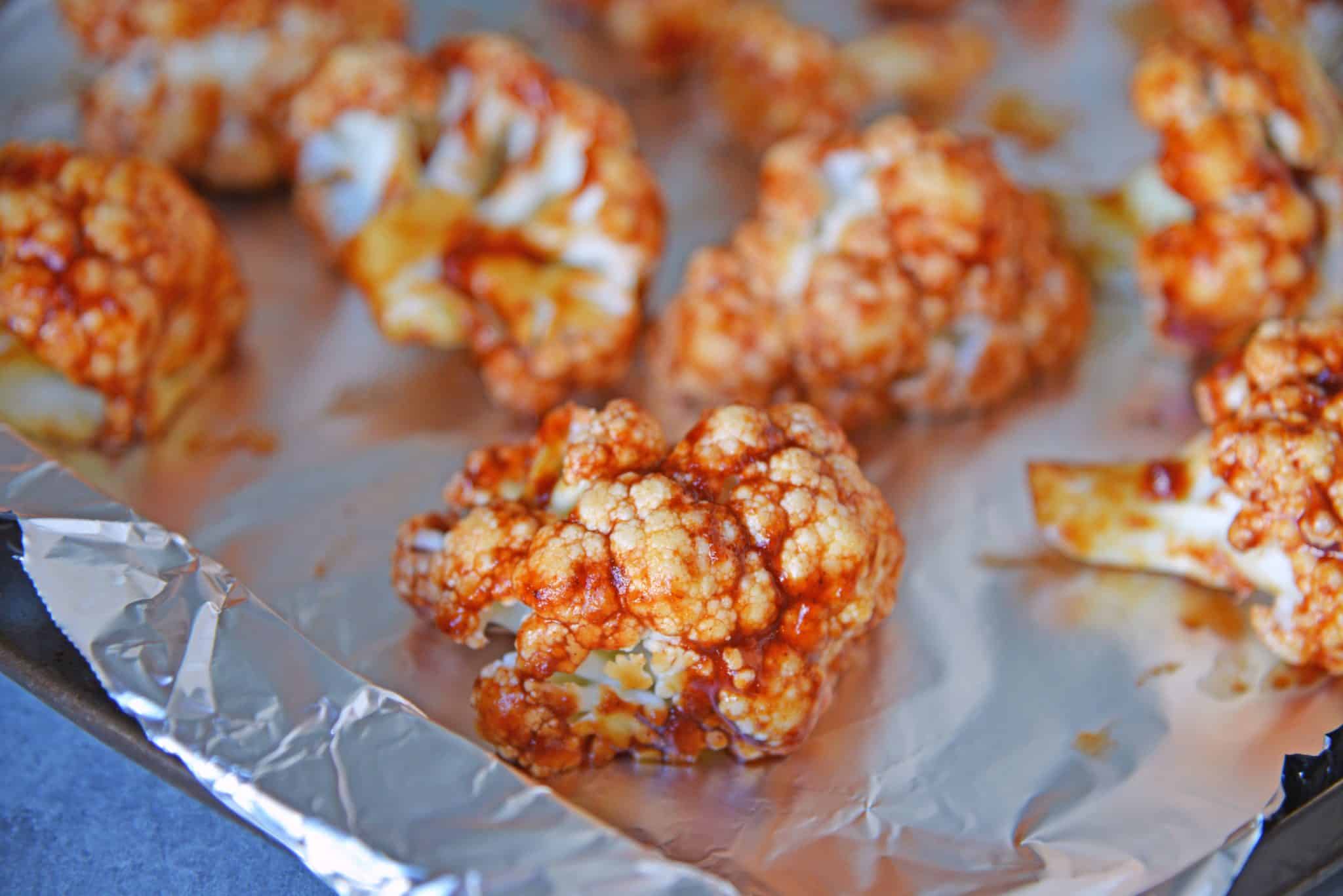 BBQ Cauliflower Bites make a healthy and quick appetizer or side. Make them zesty, tangy or even sweet! #cauliflowerrecipes #bbqcauliflowerbites www.savoryexperiments.com 