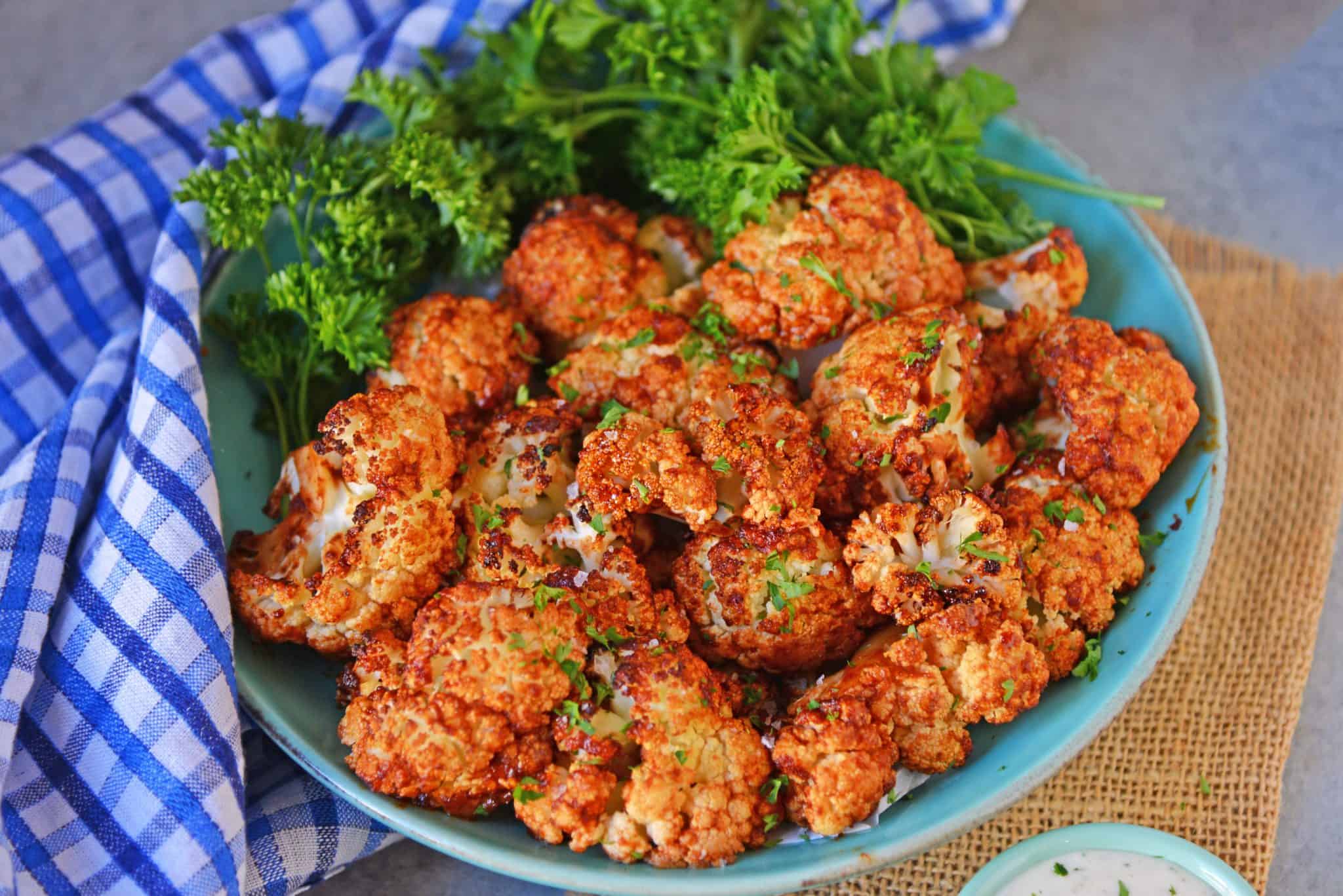 BBQ Cauliflower Bites make a healthy and quick appetizer or side. Make them zesty, tangy or even sweet! #cauliflowerrecipes #bbqcauliflowerbites www.savoryexperiments.com