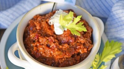 Blue Ribbon Award Winning Chili is, you guessed it, a chili cook-off winning recipe! A robust and rich stew loaded with beef, sausage, bacon and tons of vegetables. The best chili recipe ever! #awardwinningchili #bestchilirecipe www.savoryexperiments.com