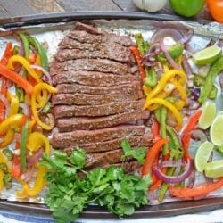 Sheet Pan Steak Fajitas are an easy weeknight meal using tender beef, homemade fajita seasoning, peppers, onions and jalapenos! #sheetpanrecipes #steakfajitas #bestangusbeef #steakholder www.savoryexperiments.com