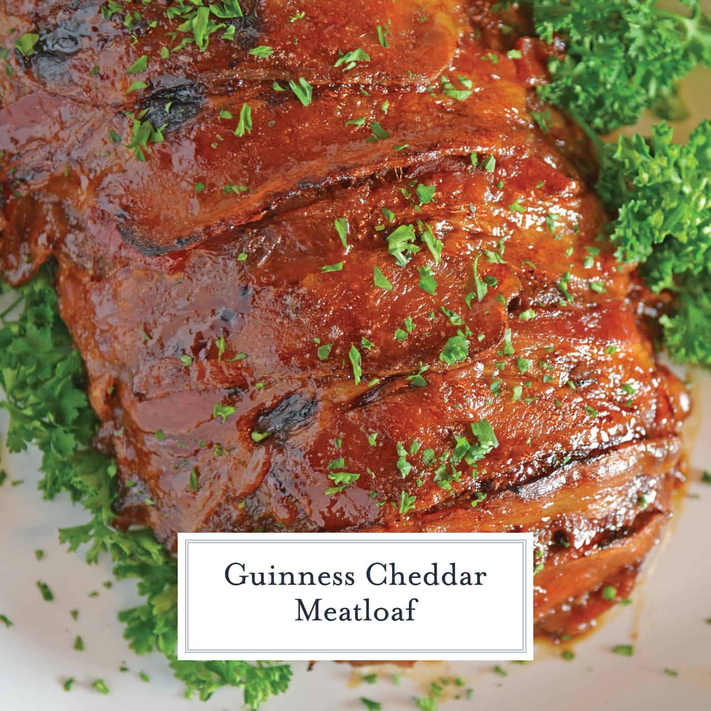 Guinness and Cheddar Meatloaf is packed with vegetables simmered in stout beer and fresh sage topped with crispy bacon and a sweet molasses glaze. #baconwrappedmeatloaf #easymeatloafrecipes www.savoryexperiments.com 