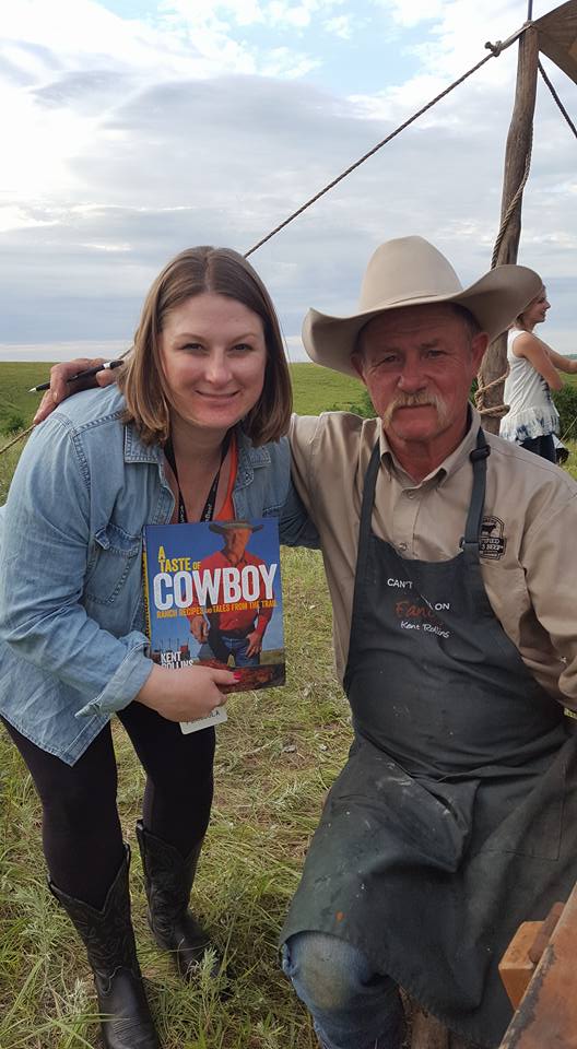 Jessica with Kent Rollins rancher holding a cowboy magazine