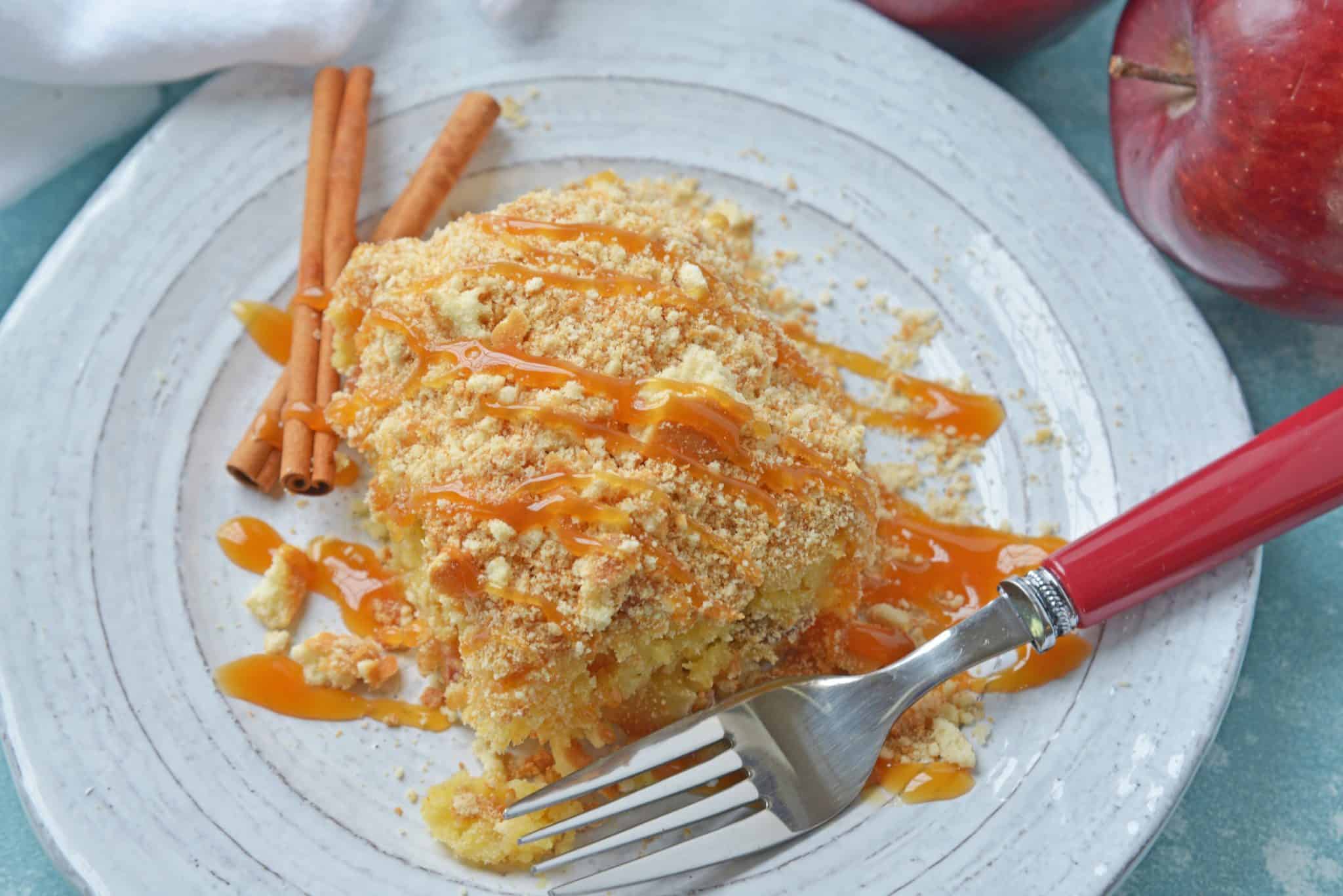 This Caramel Apple Poke Cake is one of the best recipes using boxed cake mix! With tons of apples, and cinnamon, this from scratch apple cake will become an instant family favorite! #pokecakerecipes #recipesusingboxedcakemix #applecake #easypokecakerecipes #savoryexperiments www.savoryexperiments.com